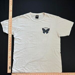 Obey Cream T-Shirt with Butterfly Graphic